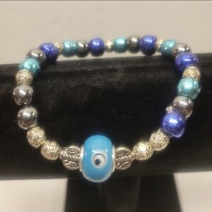 Silver and Different Colored Blue Bead Stretch Bracelet